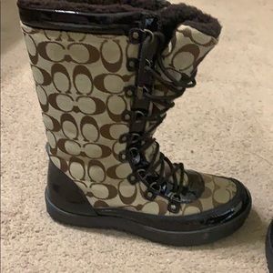 Gently used coach lace-up boots.
